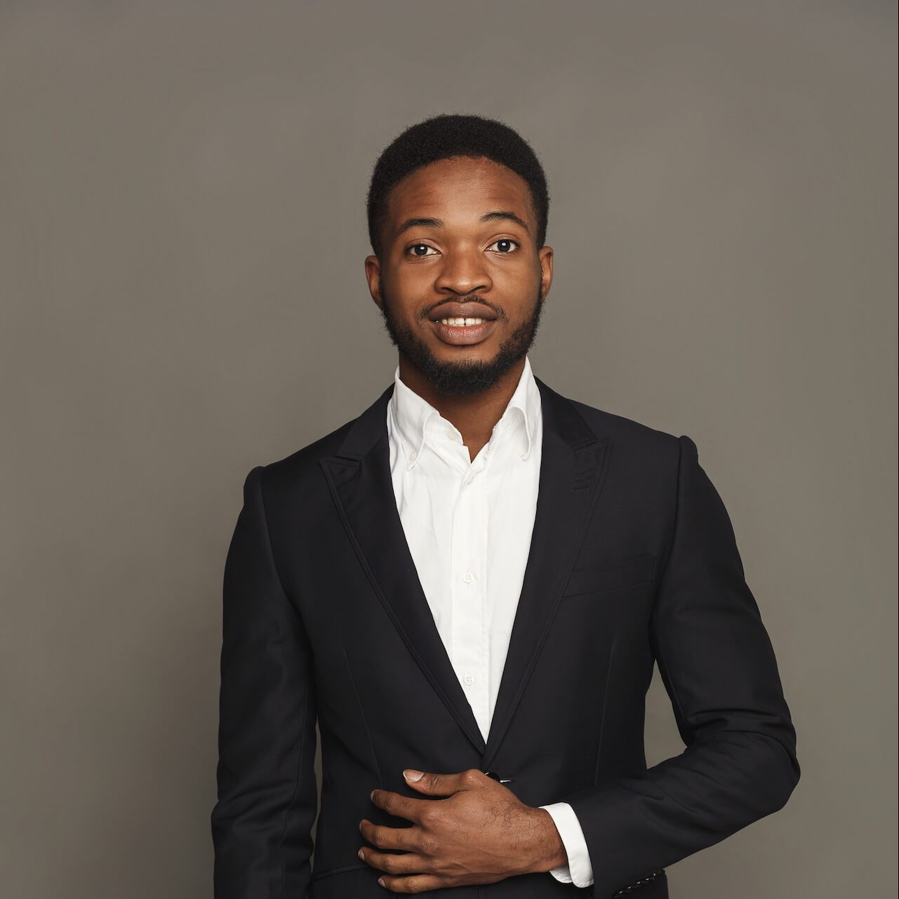 handsome-young-black-man-portrait-at-studio-backgr-2021-08-26-16-32-08-utc-e1653971119475.jpg