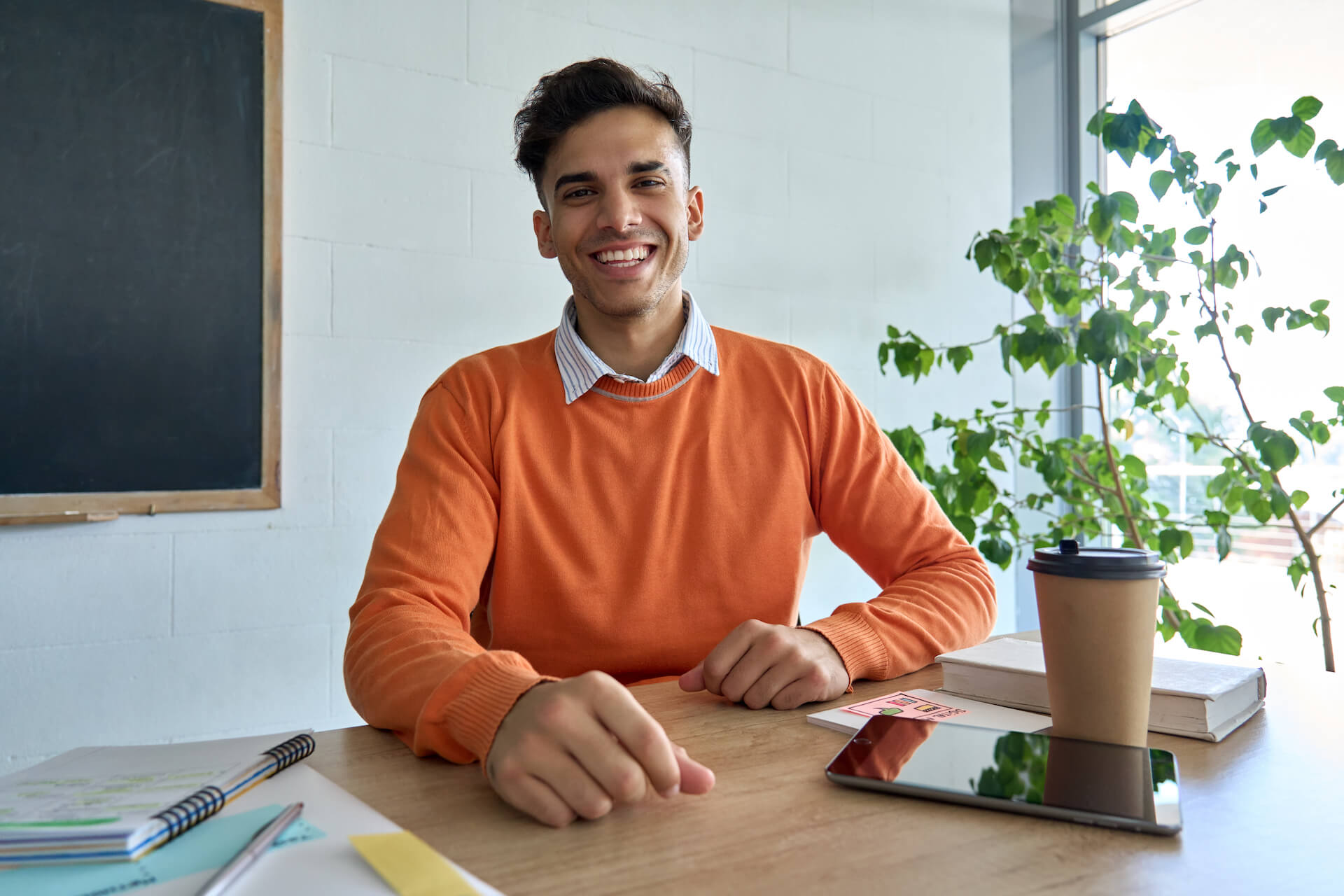 happy-smiling-indian-student-looking-at-camera-sit-2021-09-03-20-45-32-utc.jpg